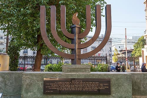 Romania-Bucharest-Choral Temple Synagogue Menorah sculpture in front Art Print